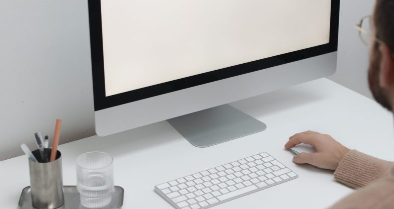 Free Crop man working on computer in workplace Stock Photo
